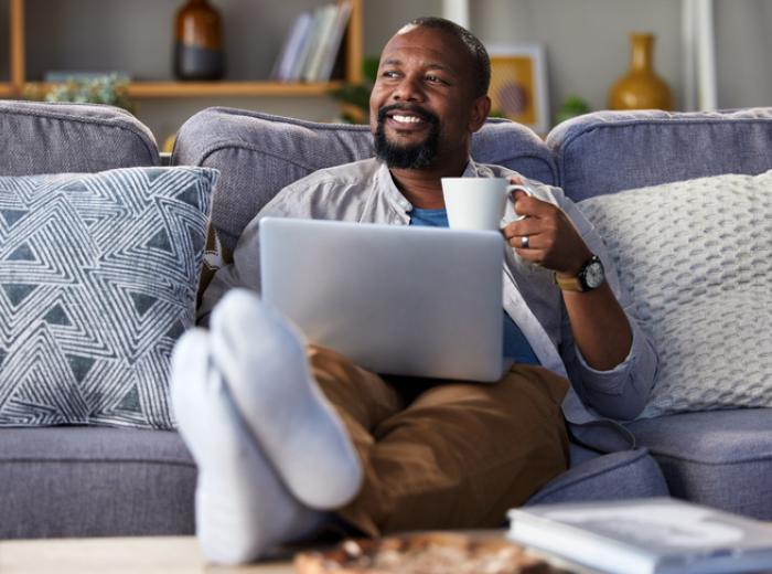 Man on couch with laptop