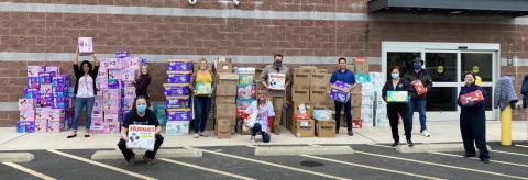 Members of the NWFCU Foundation and Volunteers with Diaper Drive Donations
