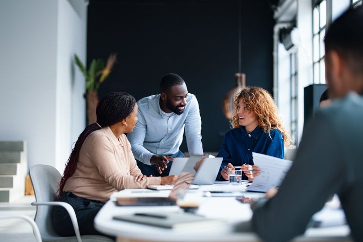 Professional team collaborating during a meeting in a modern office space
