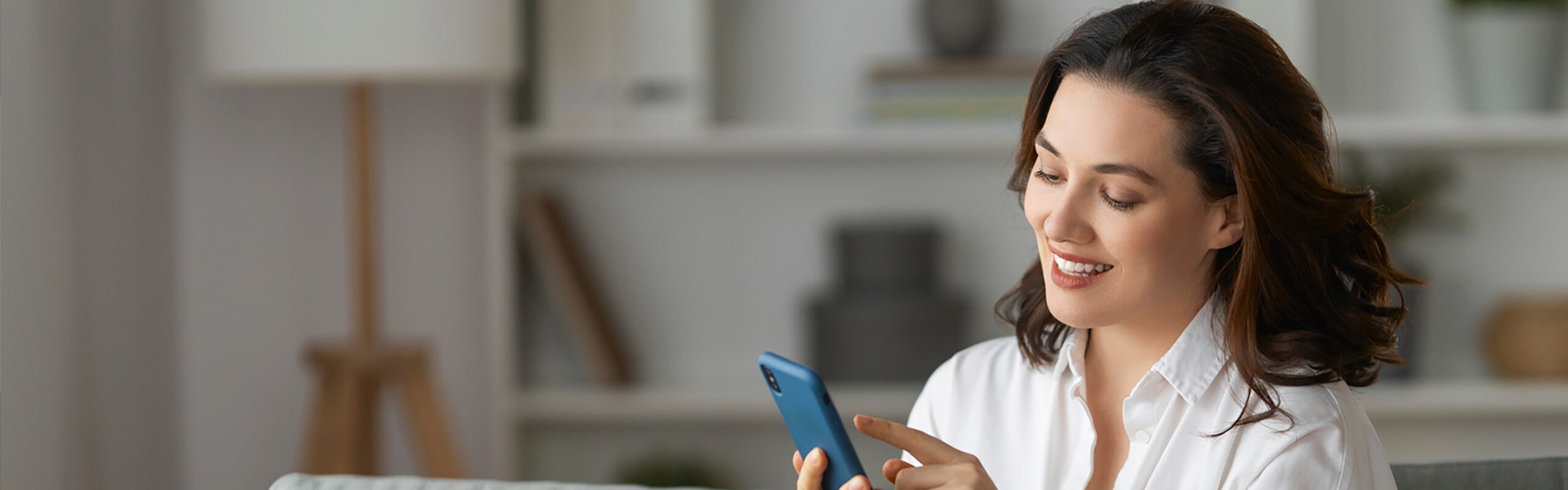 woman using phone for mobile banking